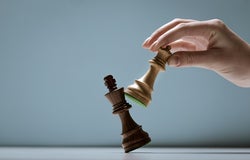 Player defeating the king and winning a chess game, strategy and tactics concept