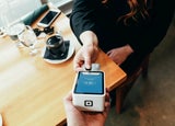 Customer paying by card at a cafe