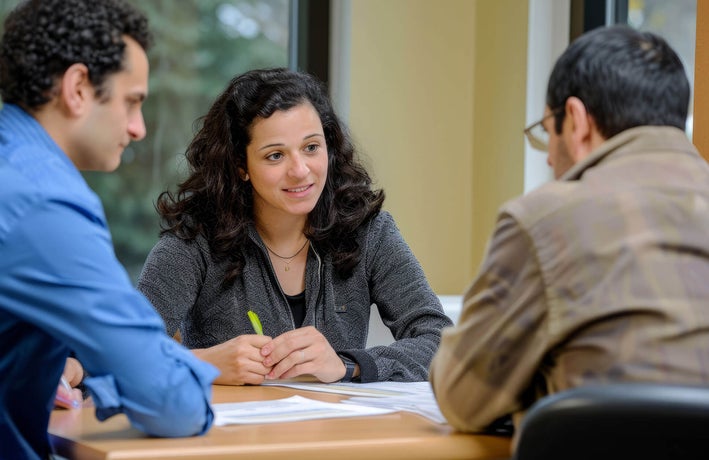 Three colleagues having a meeting