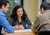 Three colleagues having a meeting