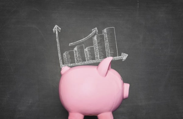 pink piggy bank against black background with a graphic of increasing piles of money on its back