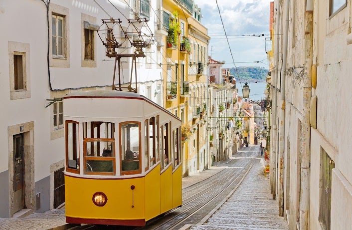 Lisbon's Gloria funicular classified as a national monument opened 1885 located on the west side of the Avenida da Liberdade connects downtown withBairro Alto.