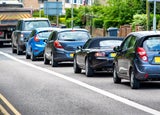 heavy traffic jam next to bus lane in england uk