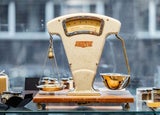 Old fashioned scales in front of a window