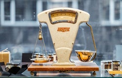 Old fashioned scales in front of a window