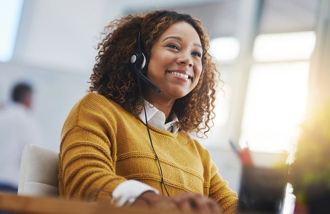 woman, call center agent or smile with voip for consulting, listening or contact us in office. Female consultant, customer service or tech support crm with headphones, microphone or help desk