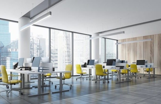 Empty city view office with yellow chairs