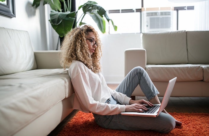 Woman designing a mission statement on at computer